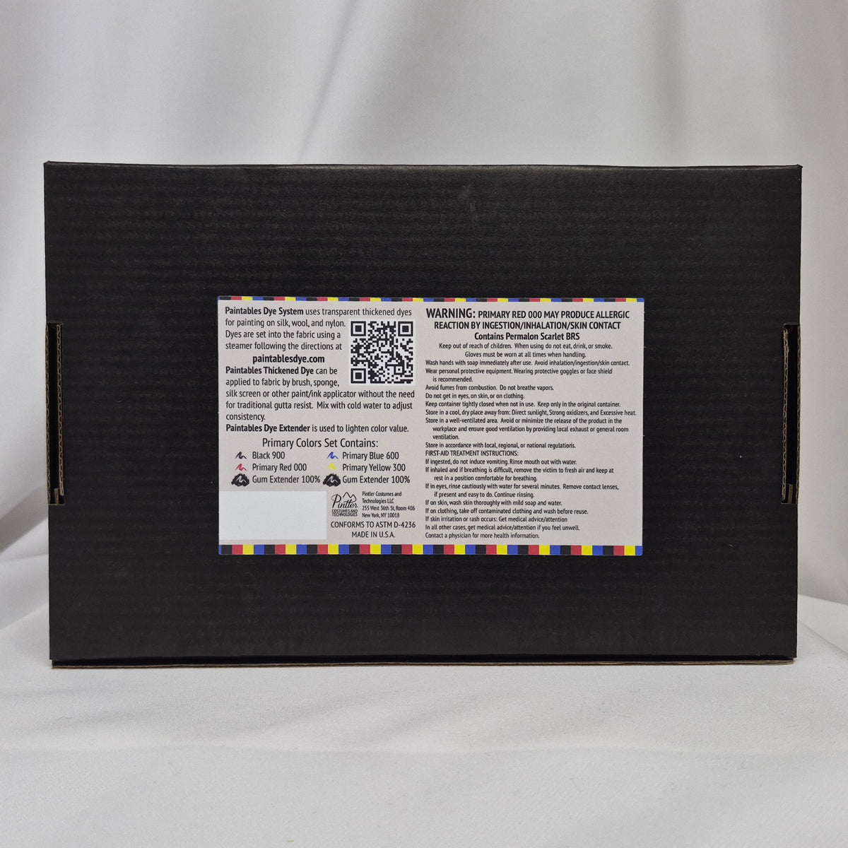 Black box with label highlighting Black, Blue, Red and Yellow and including saftey instruction, Paintables Dye System information and First-Aid Instructions