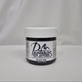 A jar of Paintables Dye System Black 900 dye, featuring a white lid and a black-and-white label, set against a draped white fabric background.